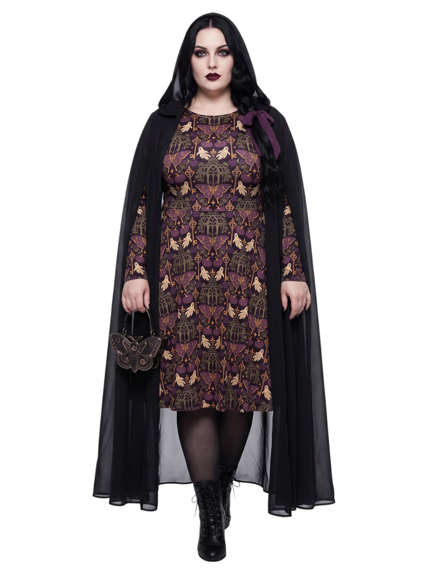 Plus size woman wearing cloak over a purple Whimsigoth gothic moth pattern long sleeve dress with pockets. 