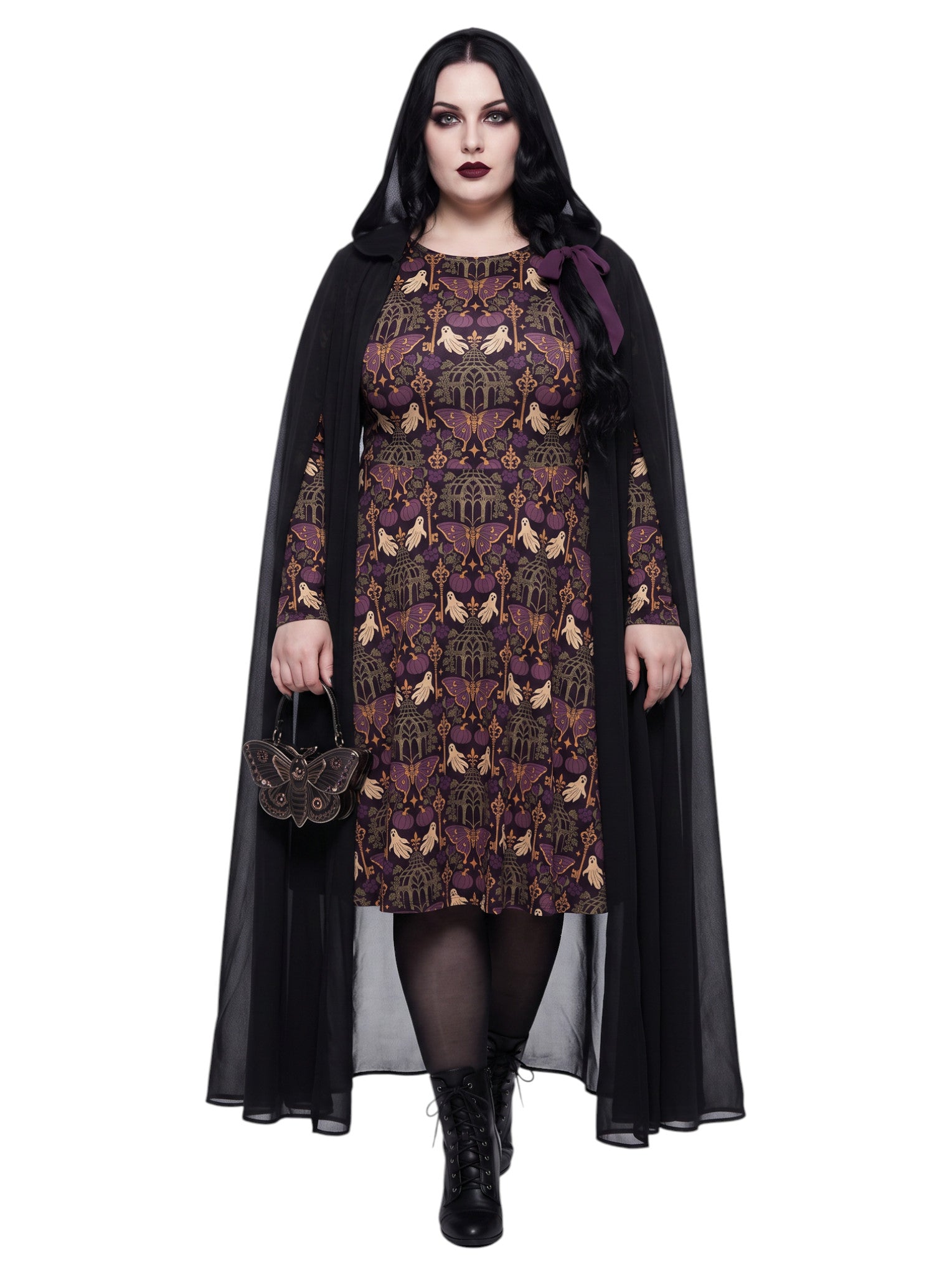 Plus size woman wearing cloak over a purple Whimsigoth gothic moth pattern long sleeve dress with pockets. 