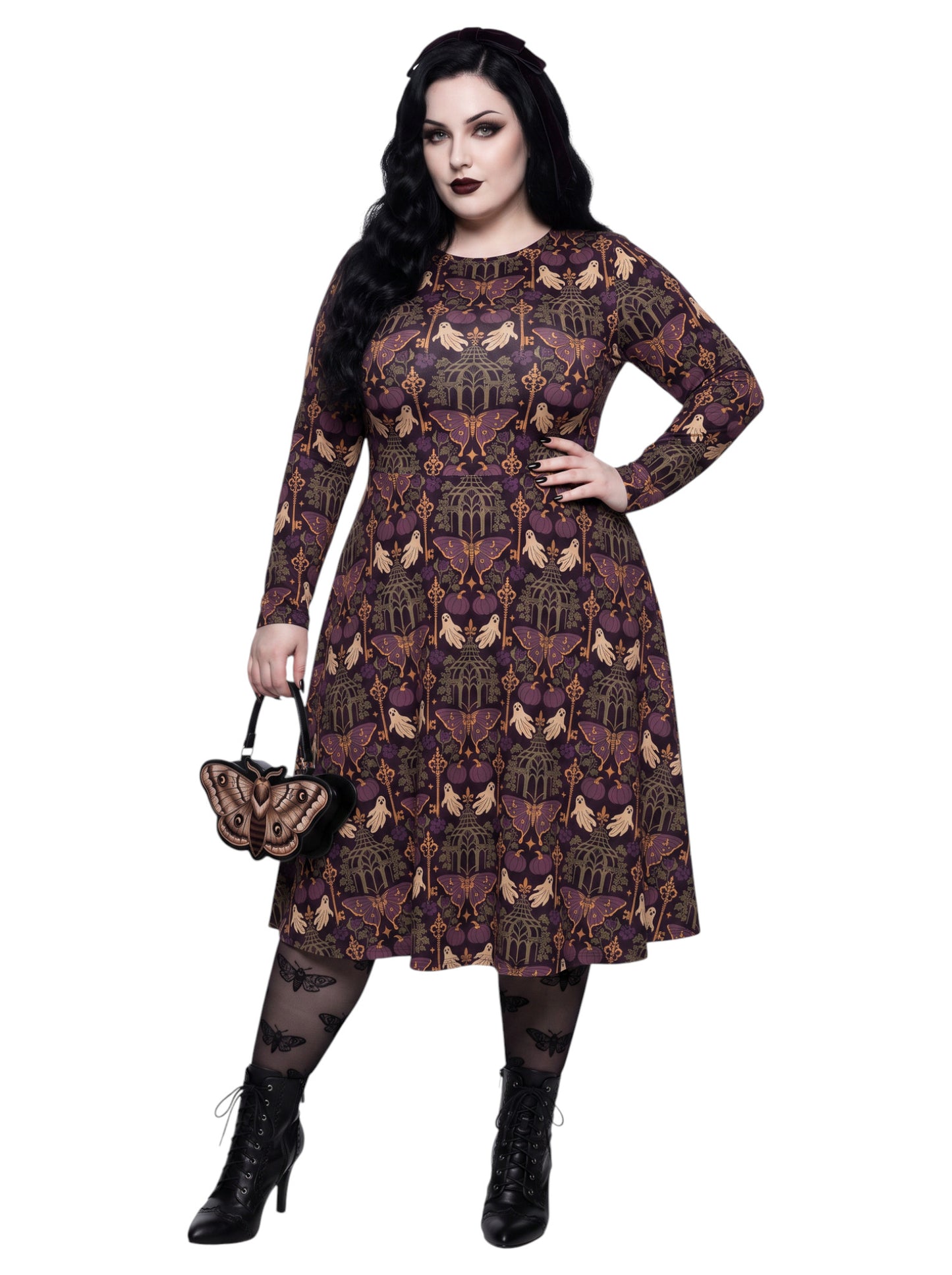 Plus size woman wearing a purple Whimsigoth gothic moth pattern long sleeve dress with pockets