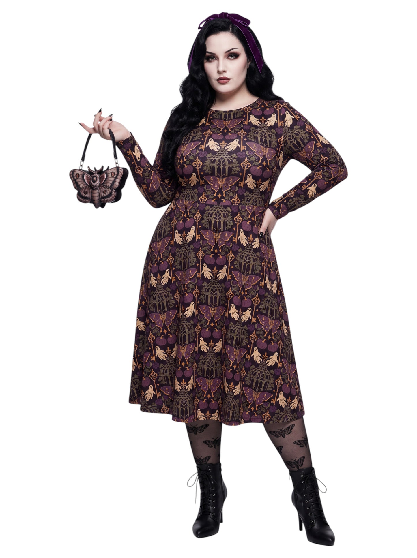 Plus size woman wearing a purple Whimsigoth gothic moth pattern long sleeve dress with pockets.