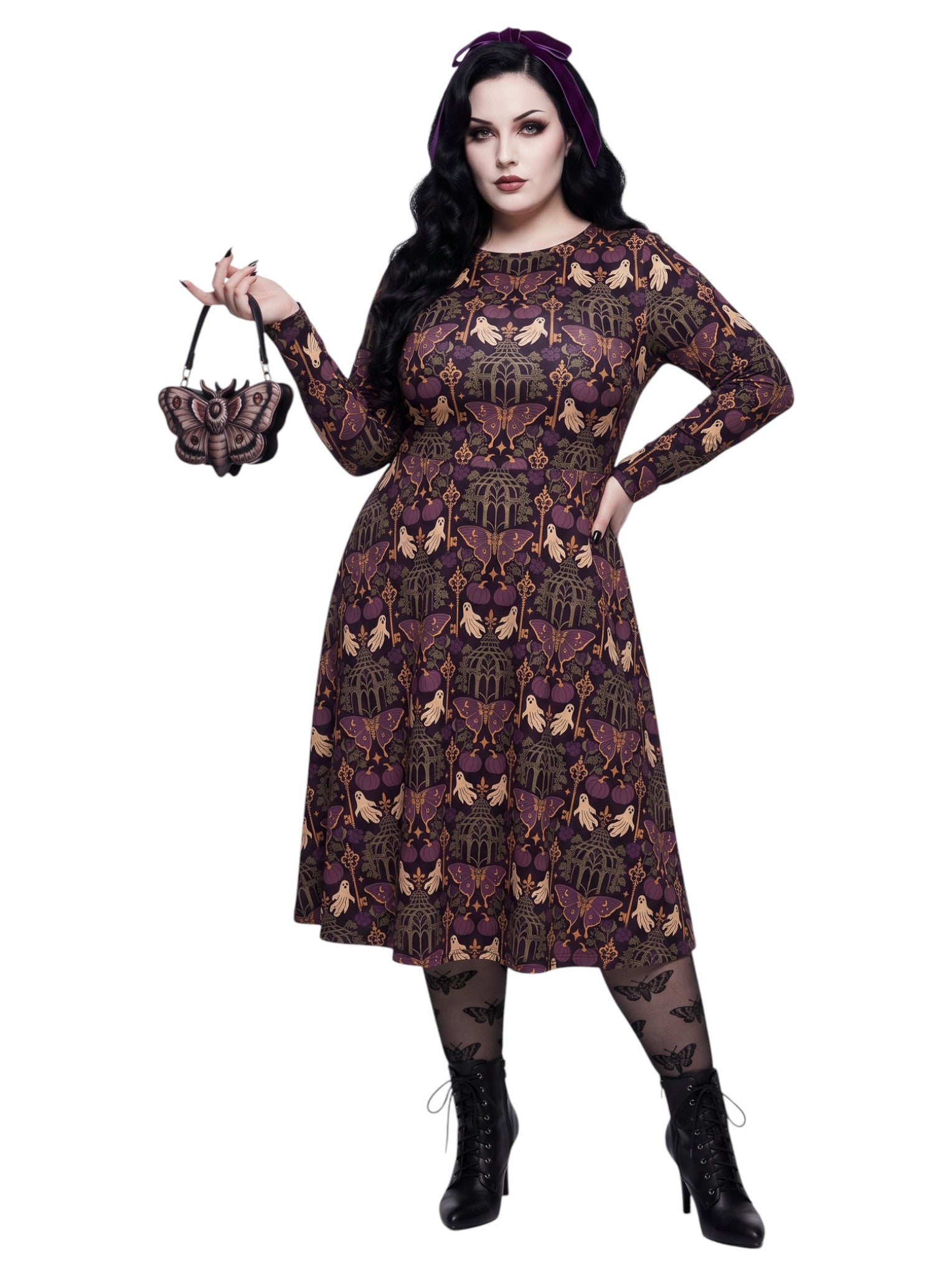 Plus size woman wearing a purple Whimsigoth gothic moth pattern long sleeve dress with pockets.