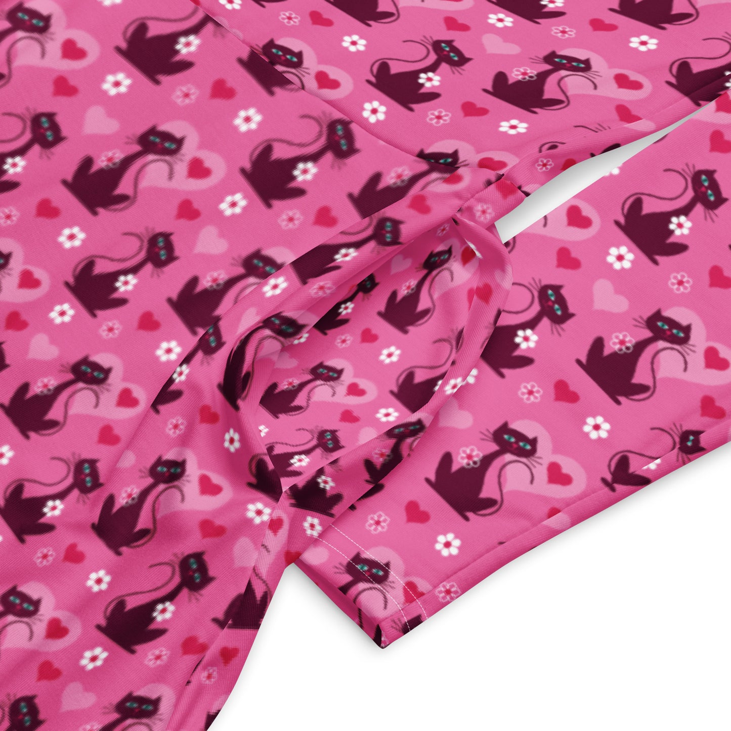 Pink retro-style long sleeve vintage 1950s dress with cat print and functional side pockets.