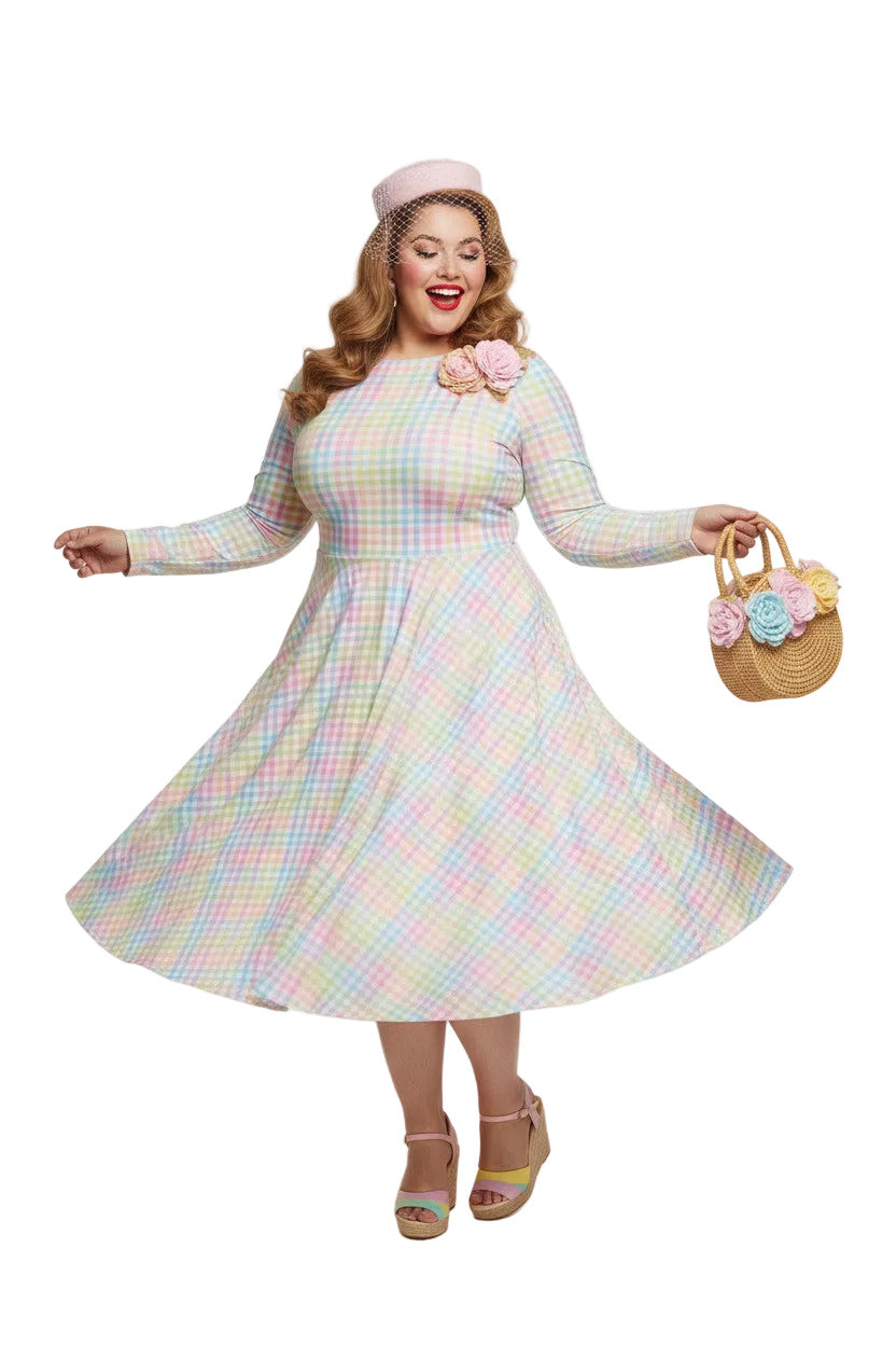 Plus size woman wearing a pastel rainbow gingham long sleeve vintage swing dress with a boat neckline and pockets.