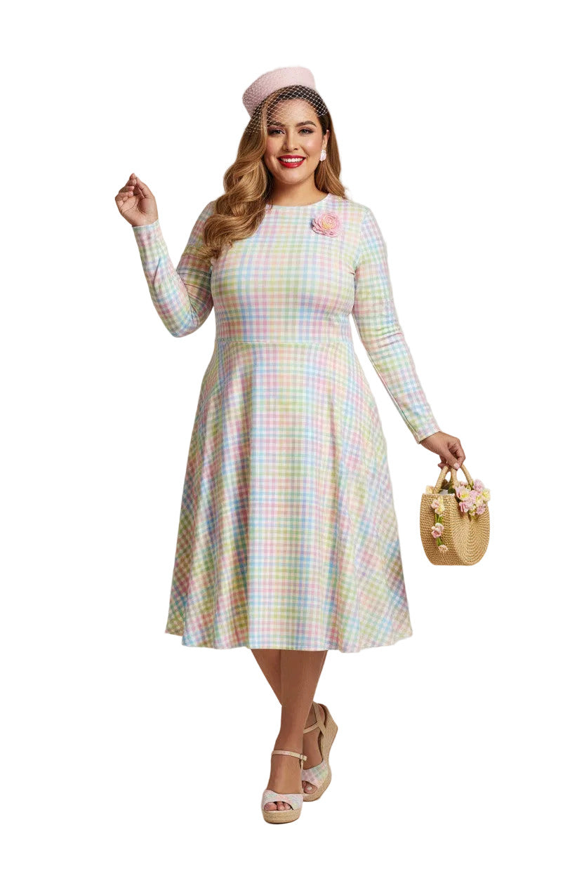 Plus size woman wearing a pastel rainbow gingham long sleeve vintage swing dress with a boat neckline and pockets.