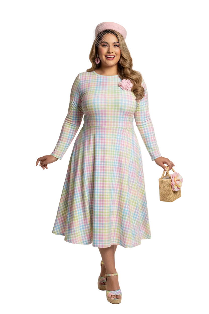 Plus size woman wearing a pastel rainbow gingham long sleeve vintage swing dress with a boat neckline and pockets.