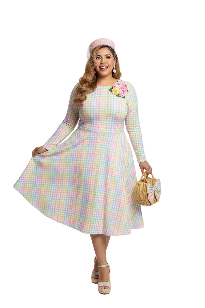 Plus size woman wearing a pastel rainbow gingham long sleeve vintage swing dress with a boat neckline and pockets.