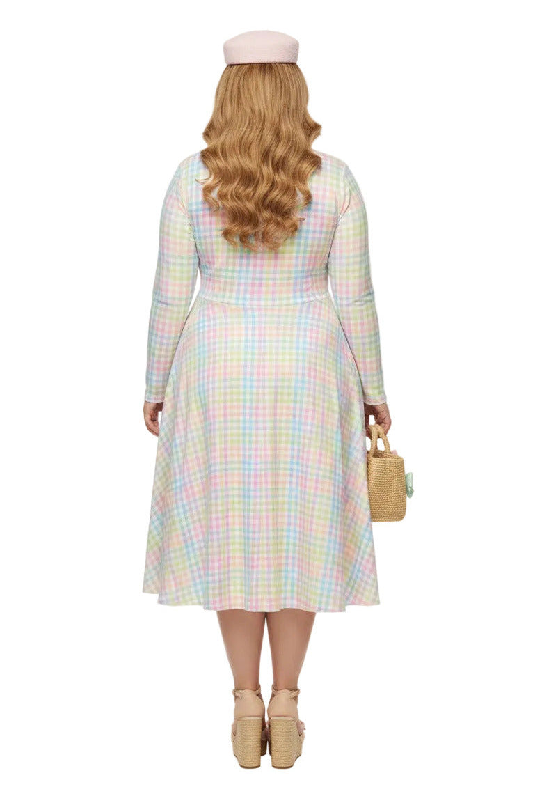 Plus size woman wearing a pastel rainbow gingham long sleeve vintage swing dress with a boat neckline and pockets.