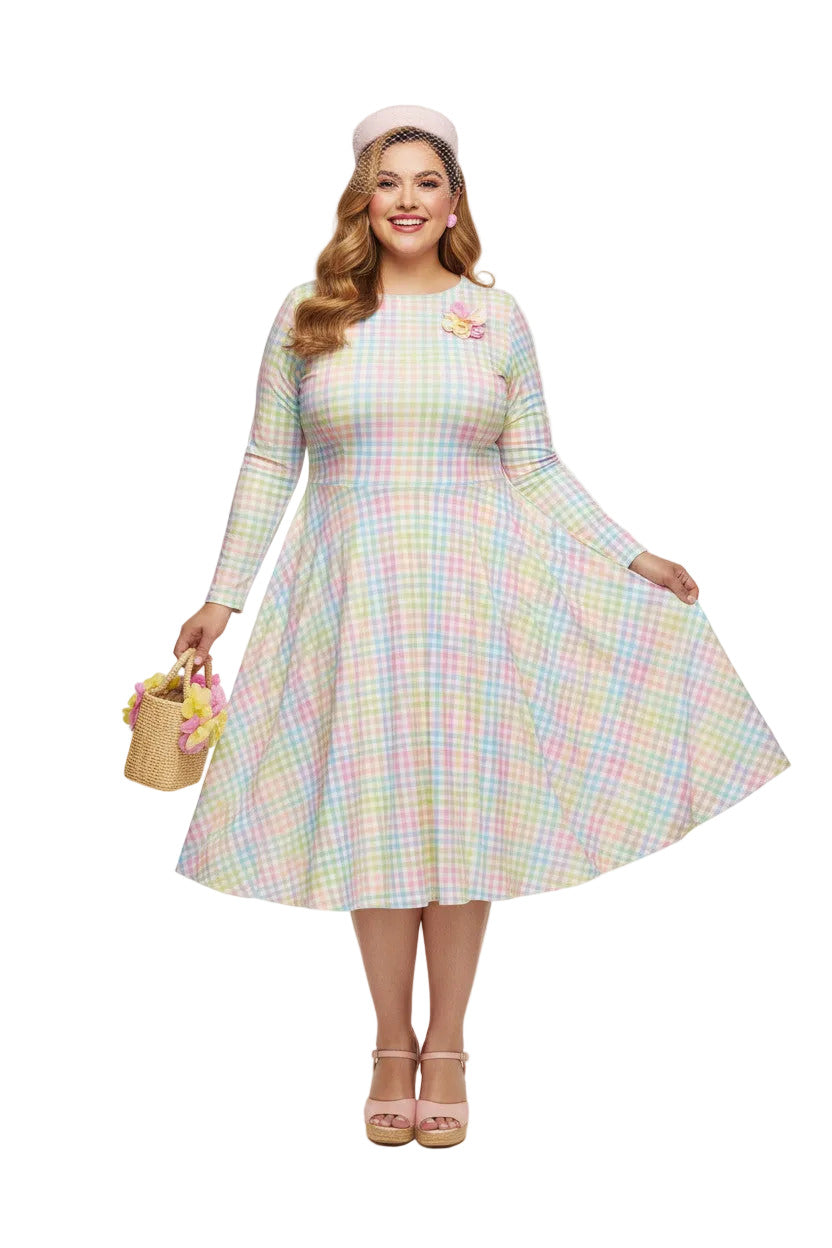 Plus size woman wearing a pastel rainbow gingham long sleeve vintage swing dress with a boat neckline and pockets.