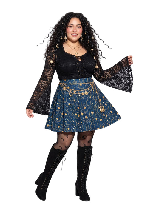 Plus-size model wearing a high-waisted whimsigoth celestial skater skirt in navy blue with a gold sun and moon pattern, featuring a soft and stretchy fit and flare silhouette.