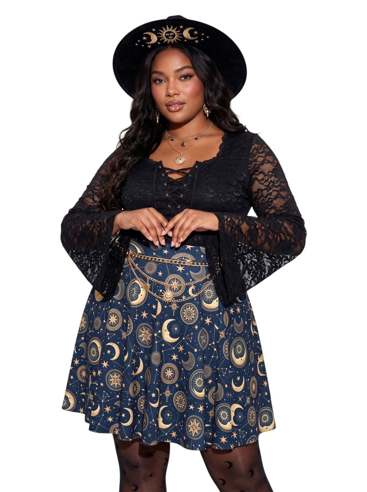 Plus size woman modeling a high-waisted whimsigoth celestial skater skirt in dark navy blue with a detailed gold sun and moon astrology pattern, styling an alternative 90s witchy outfit.