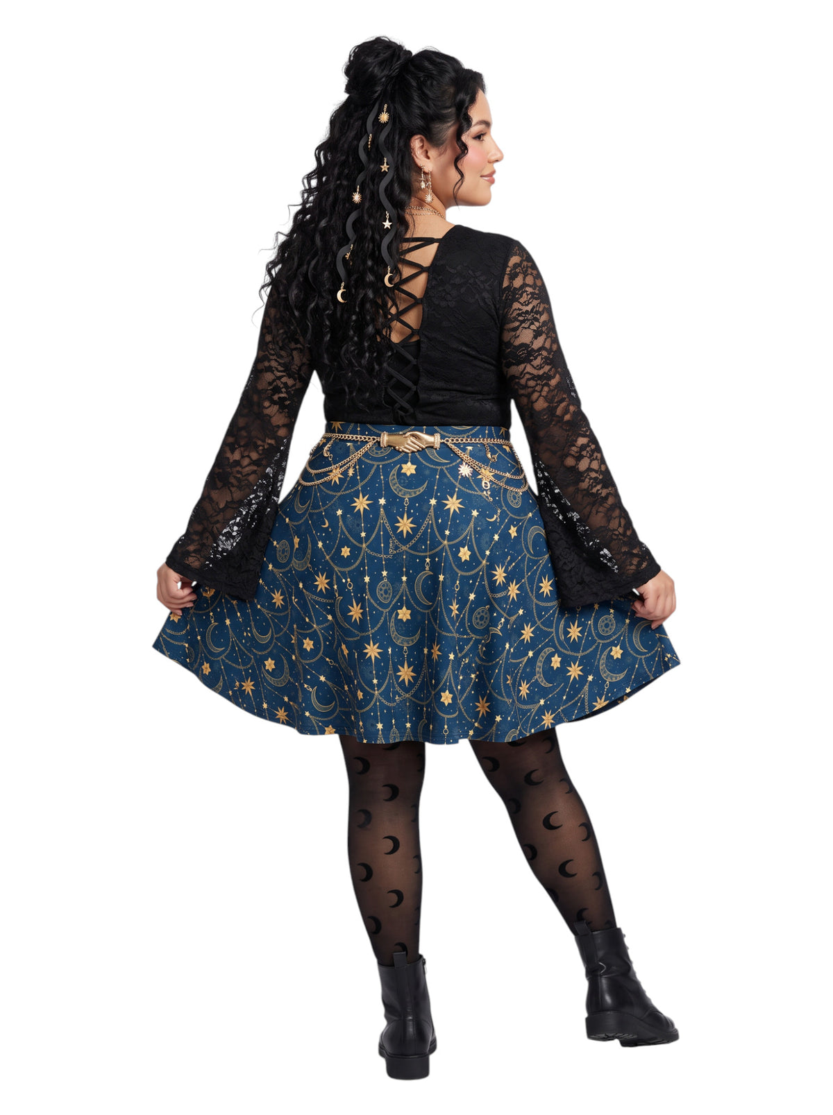 Plus-size model wearing a high-waisted whimsigoth celestial skater skirt in navy blue with a gold sun and moon pattern, featuring a soft and stretchy fit and flare silhouette.