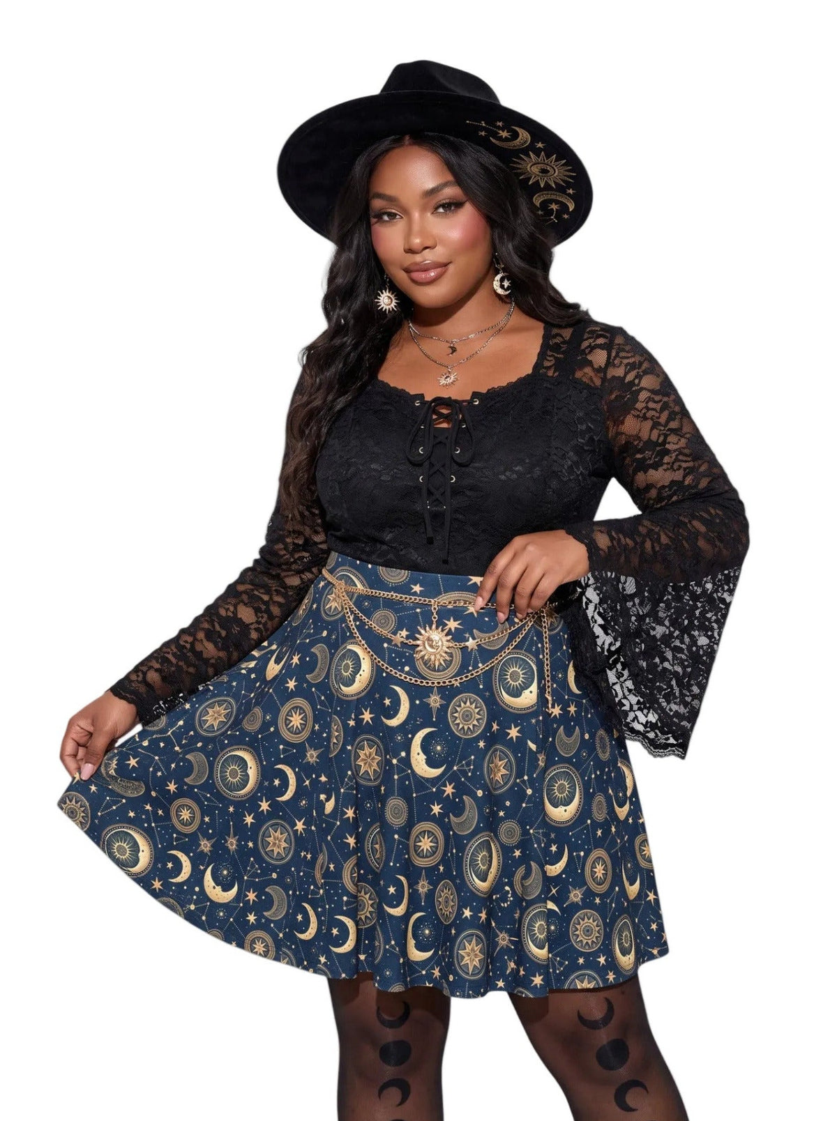 Plus size woman modeling a high-waisted whimsigoth celestial skater skirt in dark navy blue with a detailed gold sun and moon astrology pattern, styling an alternative 90s witchy outfit.