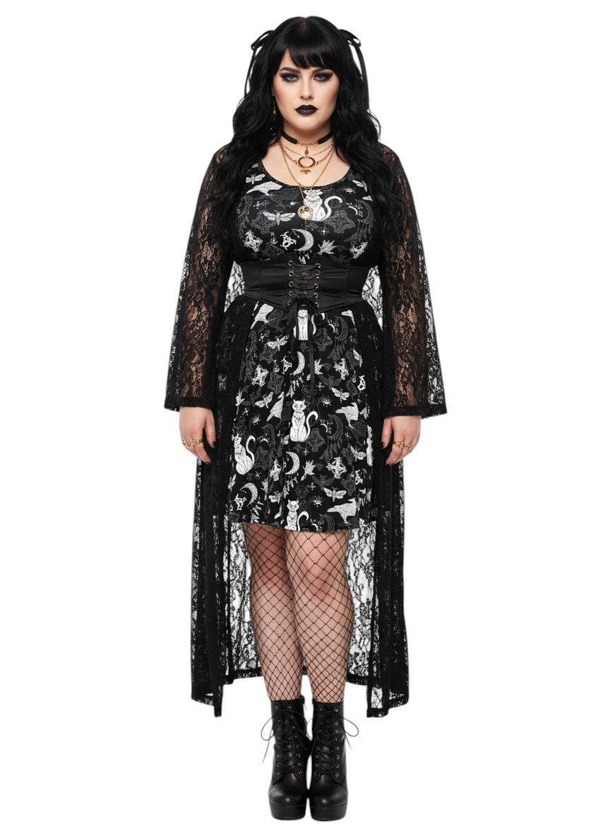 Woman wearing a Whimsigoth fit and flare dress with witchy cat and celestial moon prints.