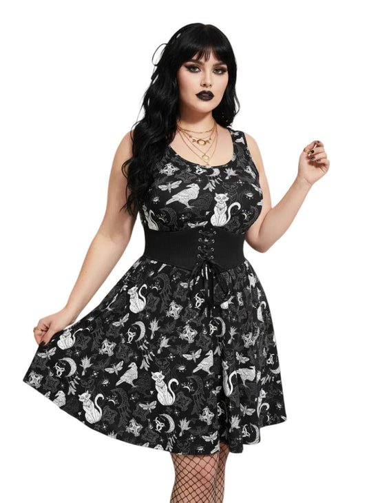 Plus size woman wearing a Whimsigoth fit and flare dress with witchy cat and celestial moon prints.