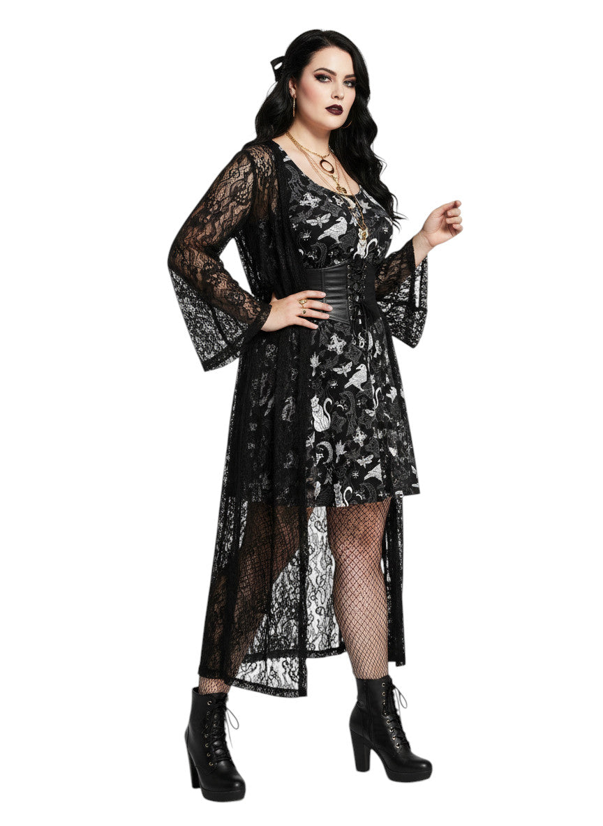 Plus size woman wearing a Whimsigoth fit and flare dress with witchy cat and celestial moon prints.