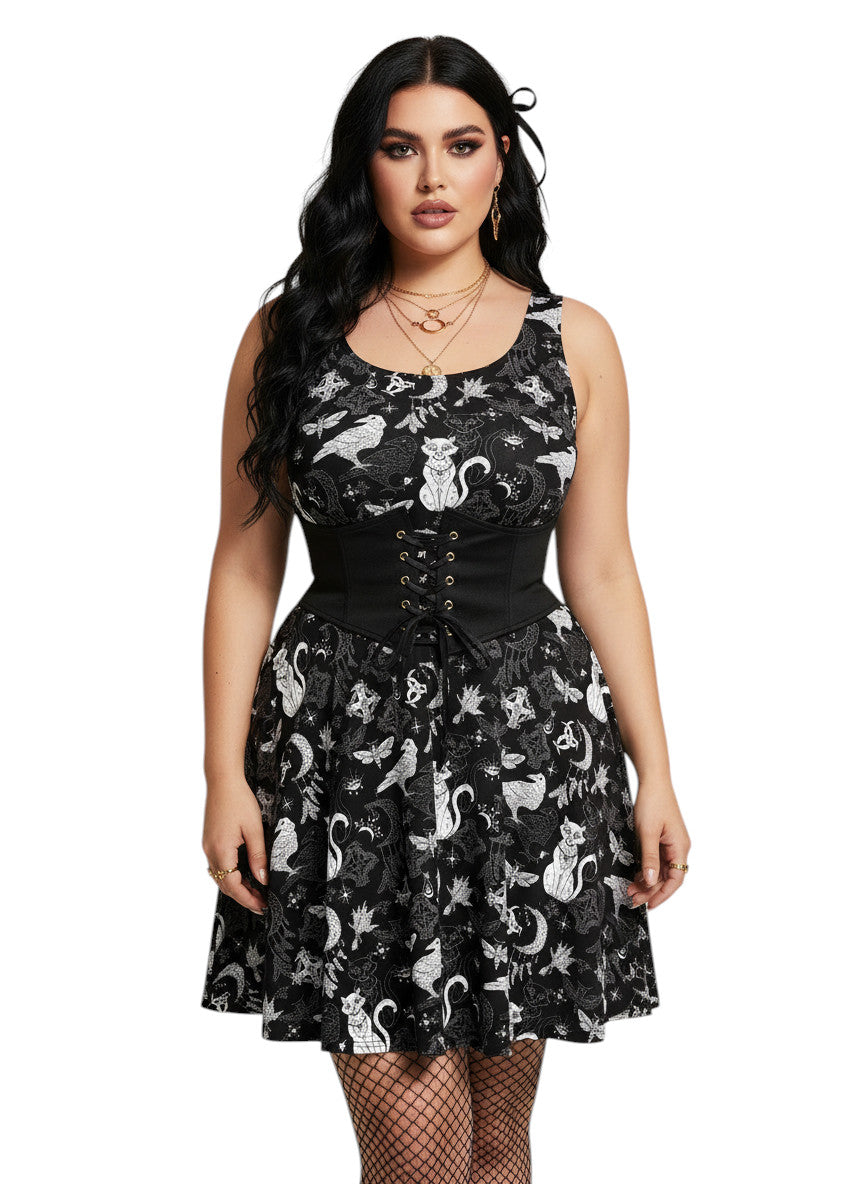 Plus size woman wearing a Whimsigoth fit and flare dress with witchy cat and celestial moon prints.
