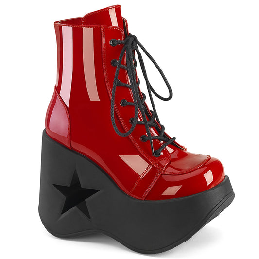 Red faux patent leather platform wedge ankle boots with 5 inch star cutout heel and black laces.