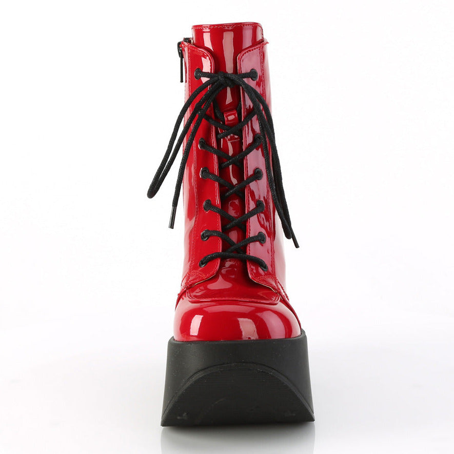 Red faux patent leather platform wedge ankle boots with 5 inch star cutout heel and black laces.