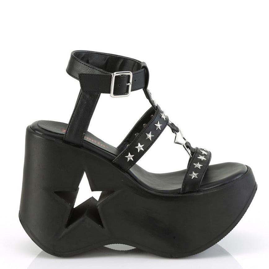 -inch black platform wedge sandal with star cutout heel and silver star studded straps.