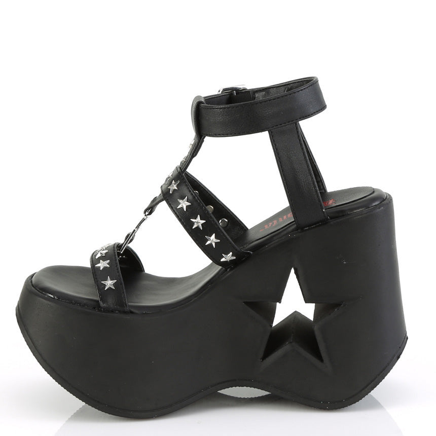 -inch black platform wedge sandal with star cutout heel and silver star studded straps.
