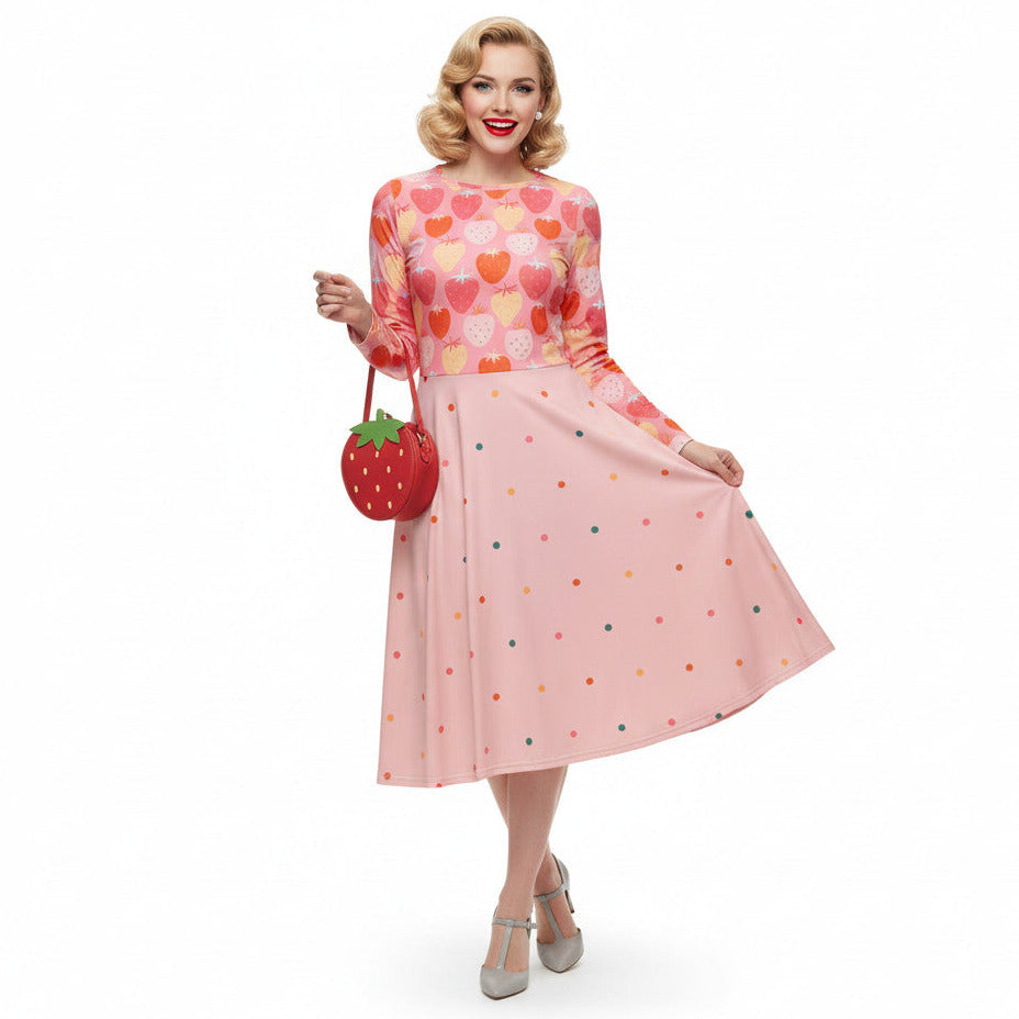woman wearing pink and red strawberry print long sleeve pin up dress with pockets