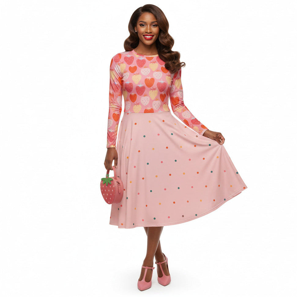 woman wearing pink and red strawberry print long sleeve pin up dress with pockets