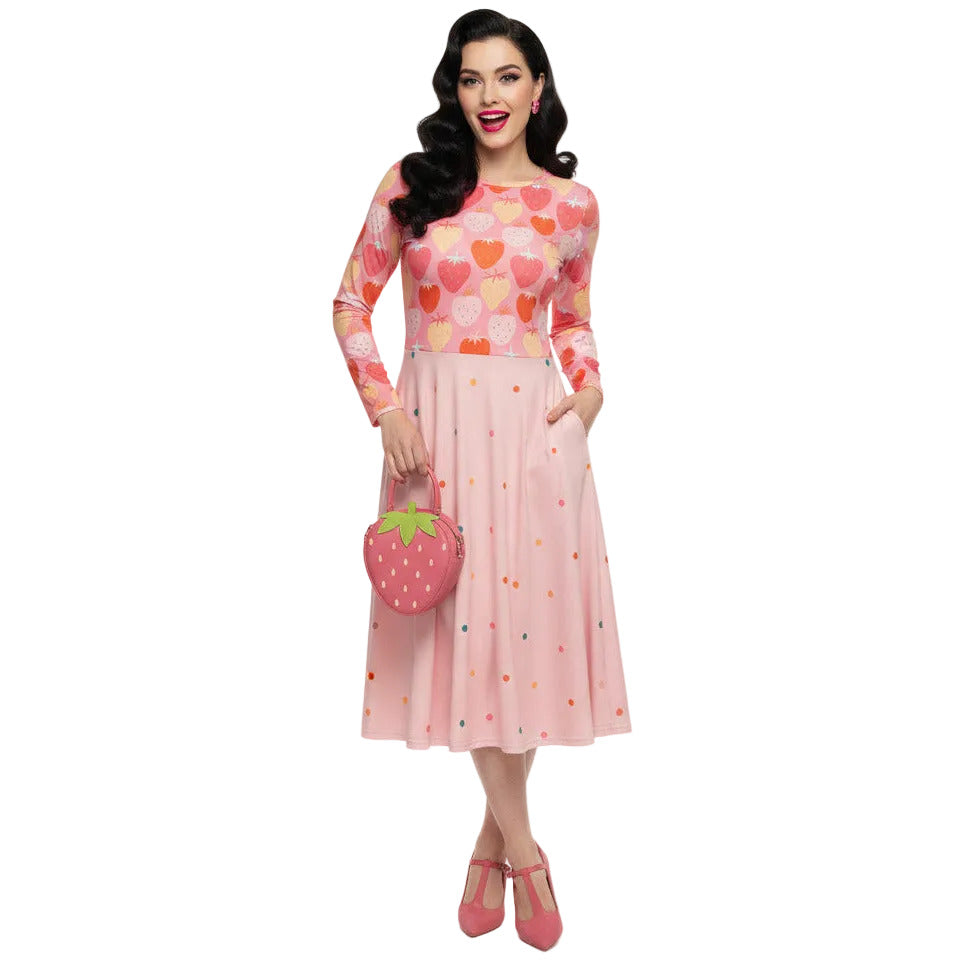 woman wearing pink strawberry print long sleeve pin up dress with pockets