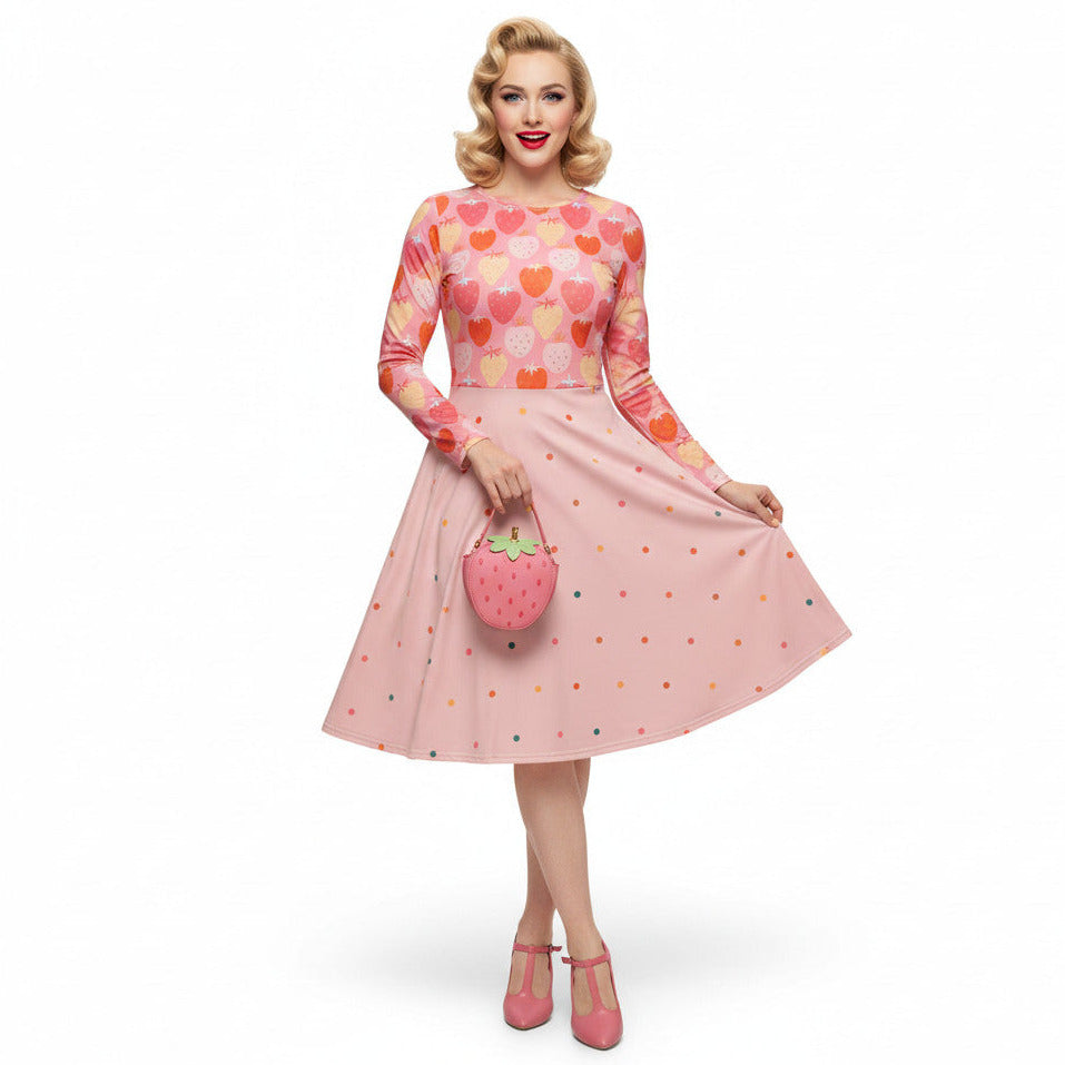 wearing pink strawberry print long sleeve pin up dress with pockets