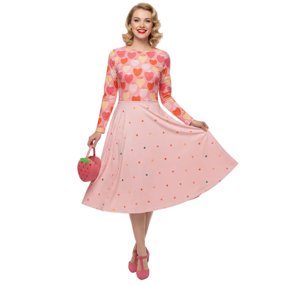 woman wearing pink strawberry print long sleeve pin up dress with pockets