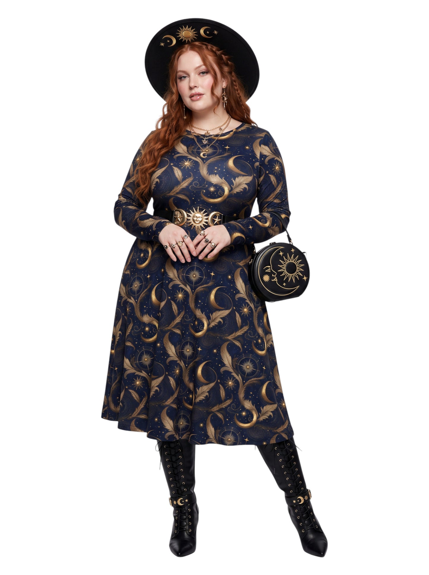 A woman modeling a dark navy blue long-sleeve dress with a gold celestial print of crescent moons and stars, styled with a matching black wide-brim hat, a gold sun motif belt, a matching round crossbody bag, and black lace-up boots against a plain white background.