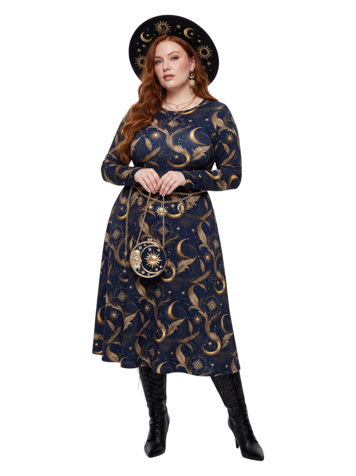 A woman modeling a long-sleeve midi dress with a celestial print in navy blue and gold, paired with a matching wide-brim hat, a small matching crossbody bag, and black knee-high boots, set against a plain white background.