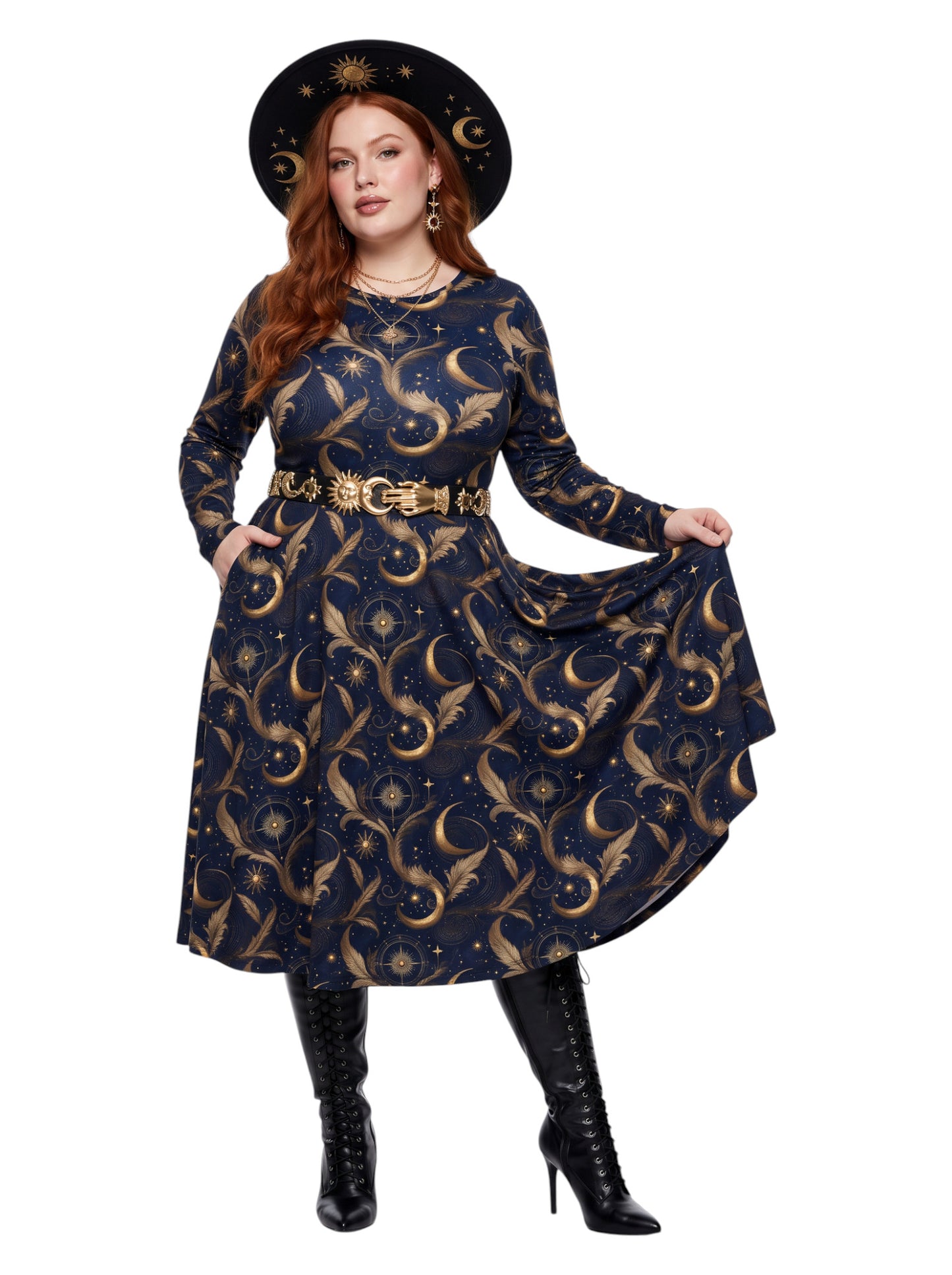Plus size woman wearing a navy blue long sleeve fit and flare midi dress with side slit pockets featuring a gold sun, moon, and stars celestial print.