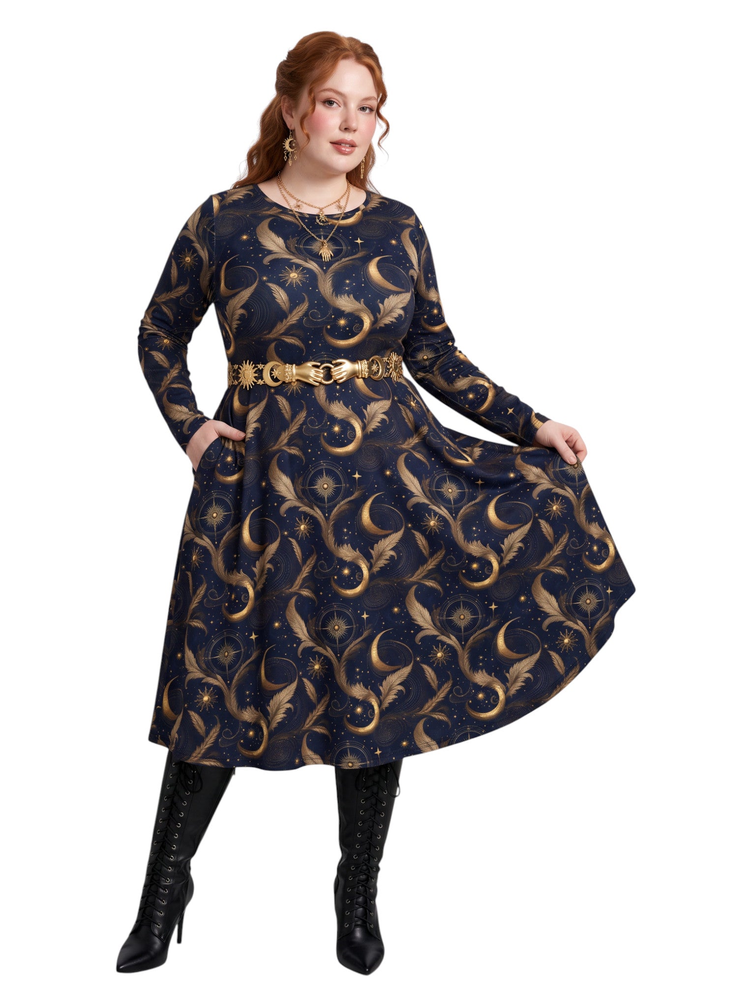 A woman wearomg a long-sleeve navy blue dress with a gold celestial pattern of crescent moons, stars, and ornate flourishes, styled with a gold belt and black knee-high boots against a white background.