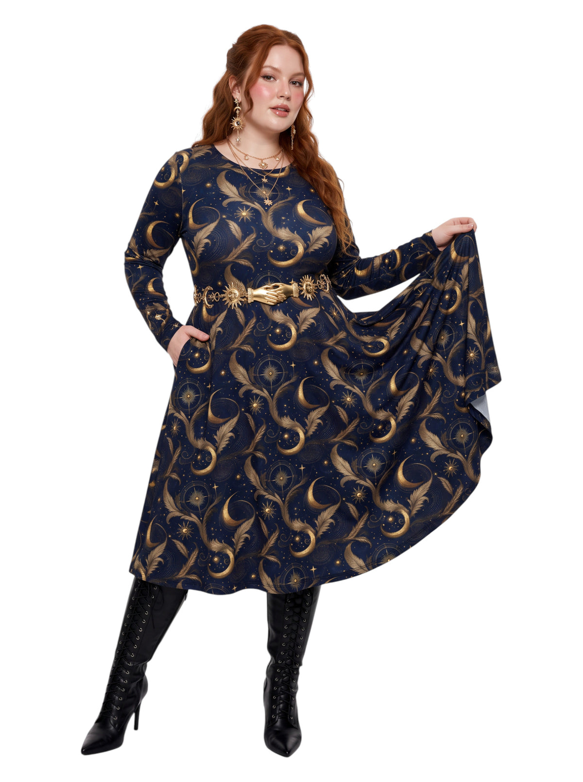 Plus size woman wearing a navy blue long sleeve fit and flare midi dress with side slit pockets featuring a gold sun, moon, and stars celestial print.