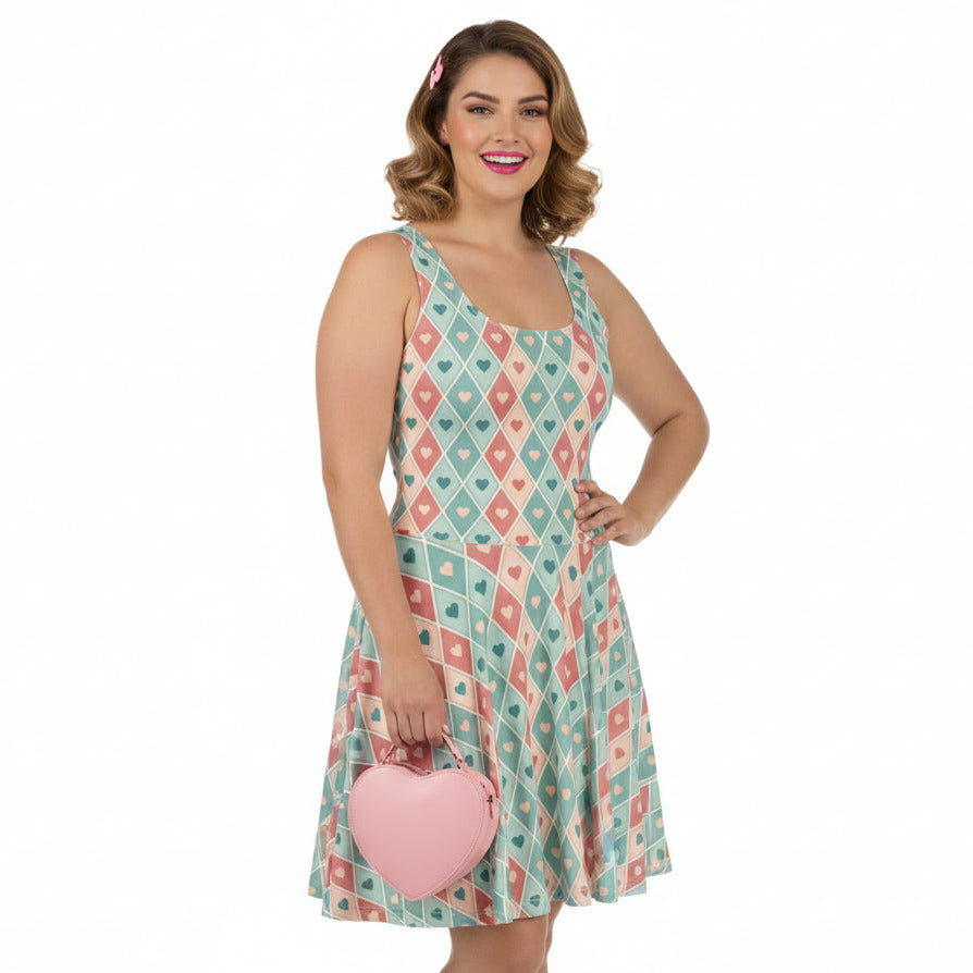 Woman wearing a patterned dress holding a pink handbag on a white background