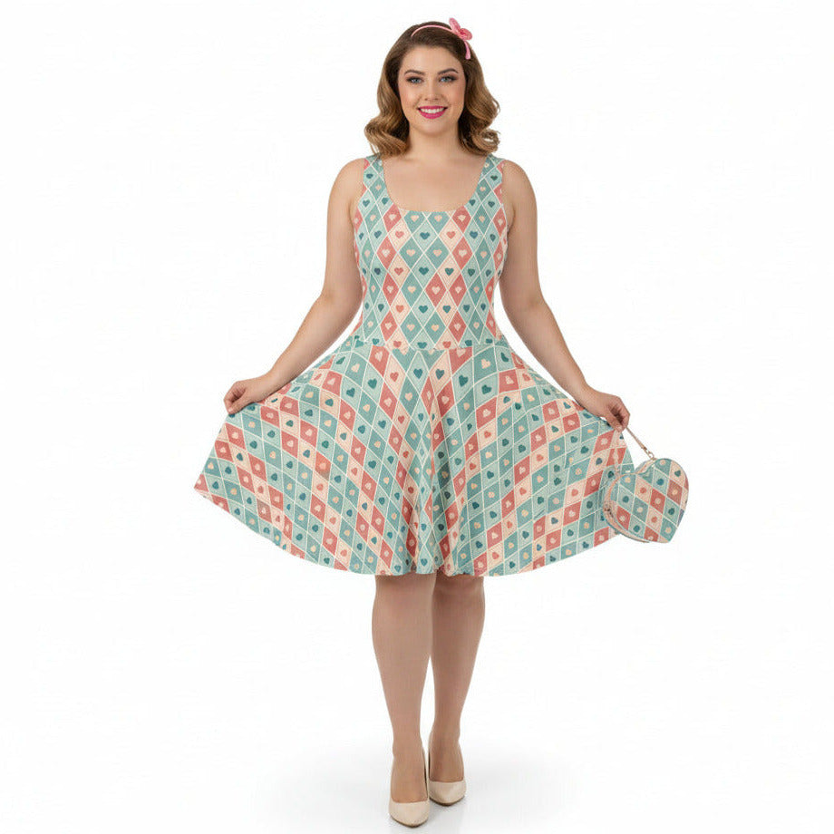 Woman wearing a patterned dress holding a matching handbag on a white background