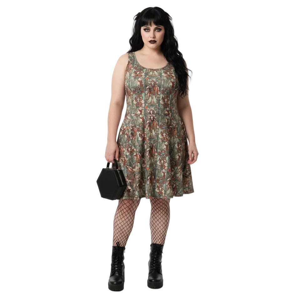 Plus size woman wearing a green Whimsigoth tarot card print skater dress with black fishnets and a gothic handbag.