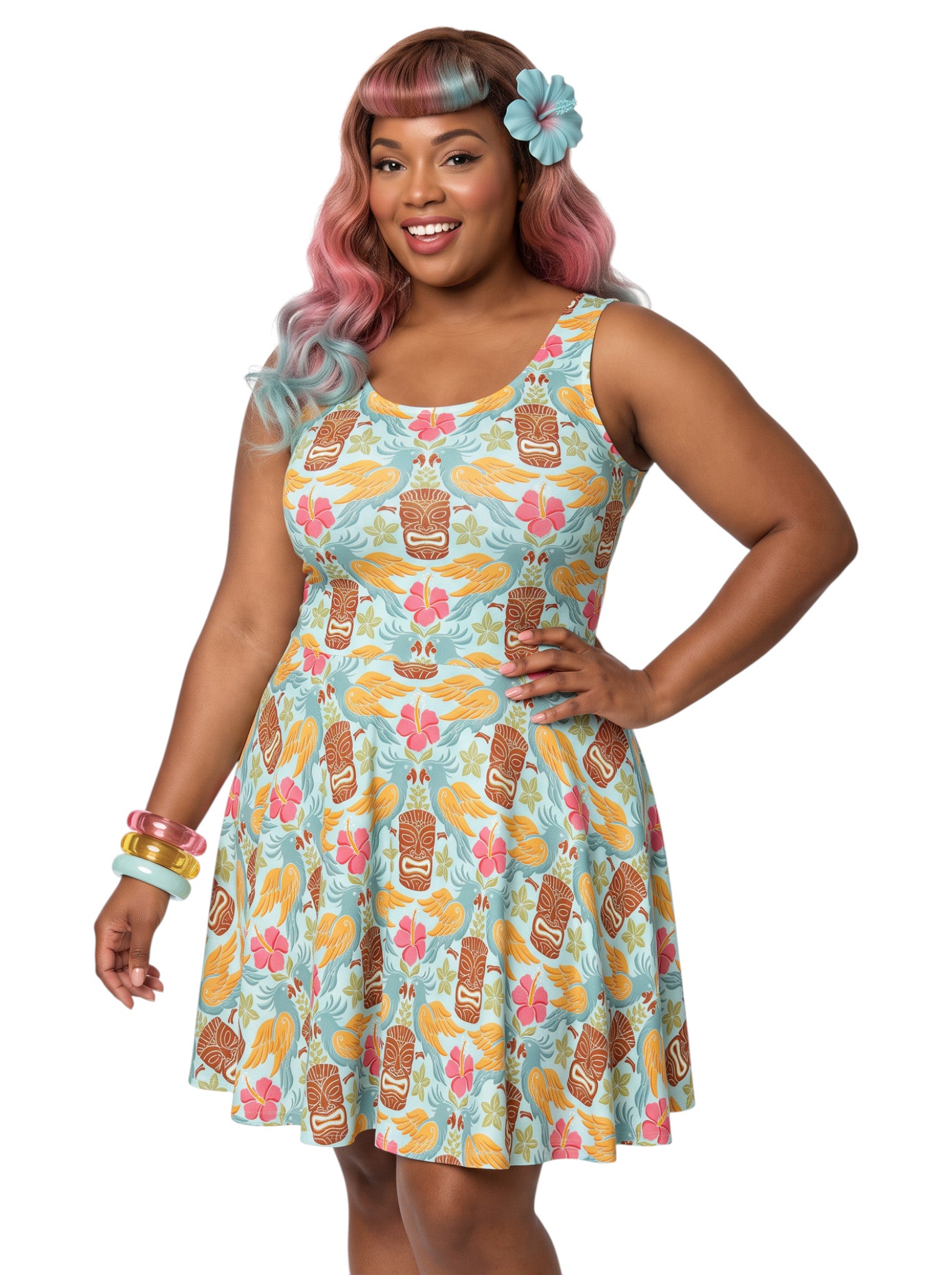 Plus-size woman in a tropical light blue Tiki mask and hibiscus flower print fit and flare swing dress highlighting a comfortable, inclusive curvy fit.