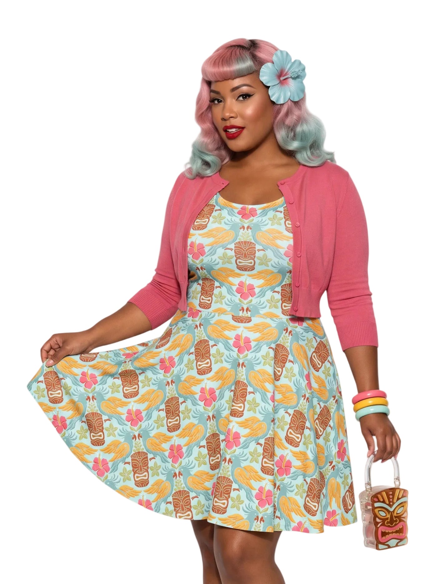 Plus-size woman in a tropical light blue Tiki mask and hibiscus flower print fit and flare swing dress highlighting a comfortable, inclusive curvy fit.