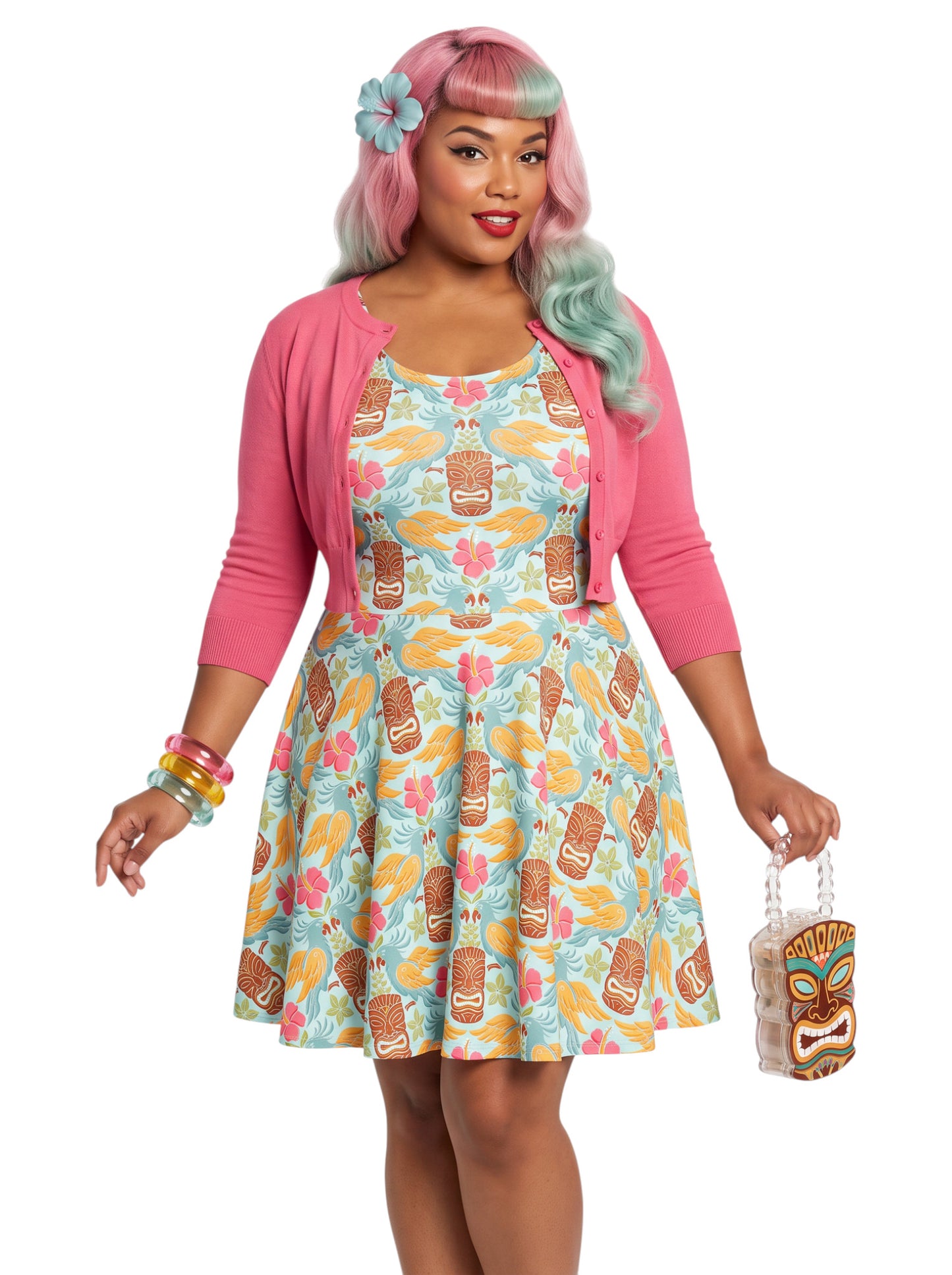 Plus-size woman in a tropical light blue Tiki mask and hibiscus flower print fit and flare swing dress highlighting a comfortable, inclusive curvy fit.