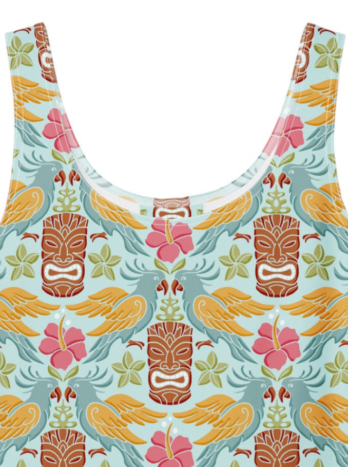 A tropical light blue Tiki mask and hibiscus flower print fit and flare swing dress.