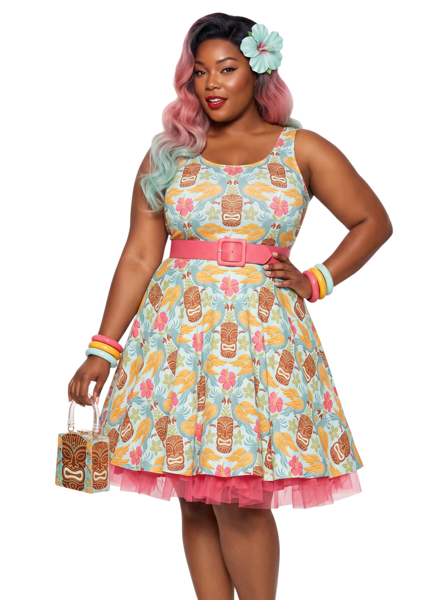 Plus-size woman in a tropical light blue Tiki mask and hibiscus flower print fit and flare swing dress highlighting a comfortable, inclusive curvy fit.