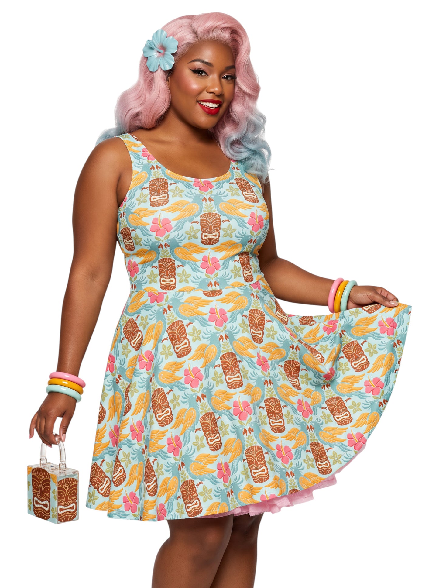 Plus-size woman in a tropical light blue Tiki mask and hibiscus flower print fit and flare swing dress highlighting a comfortable, inclusive curvy fit.