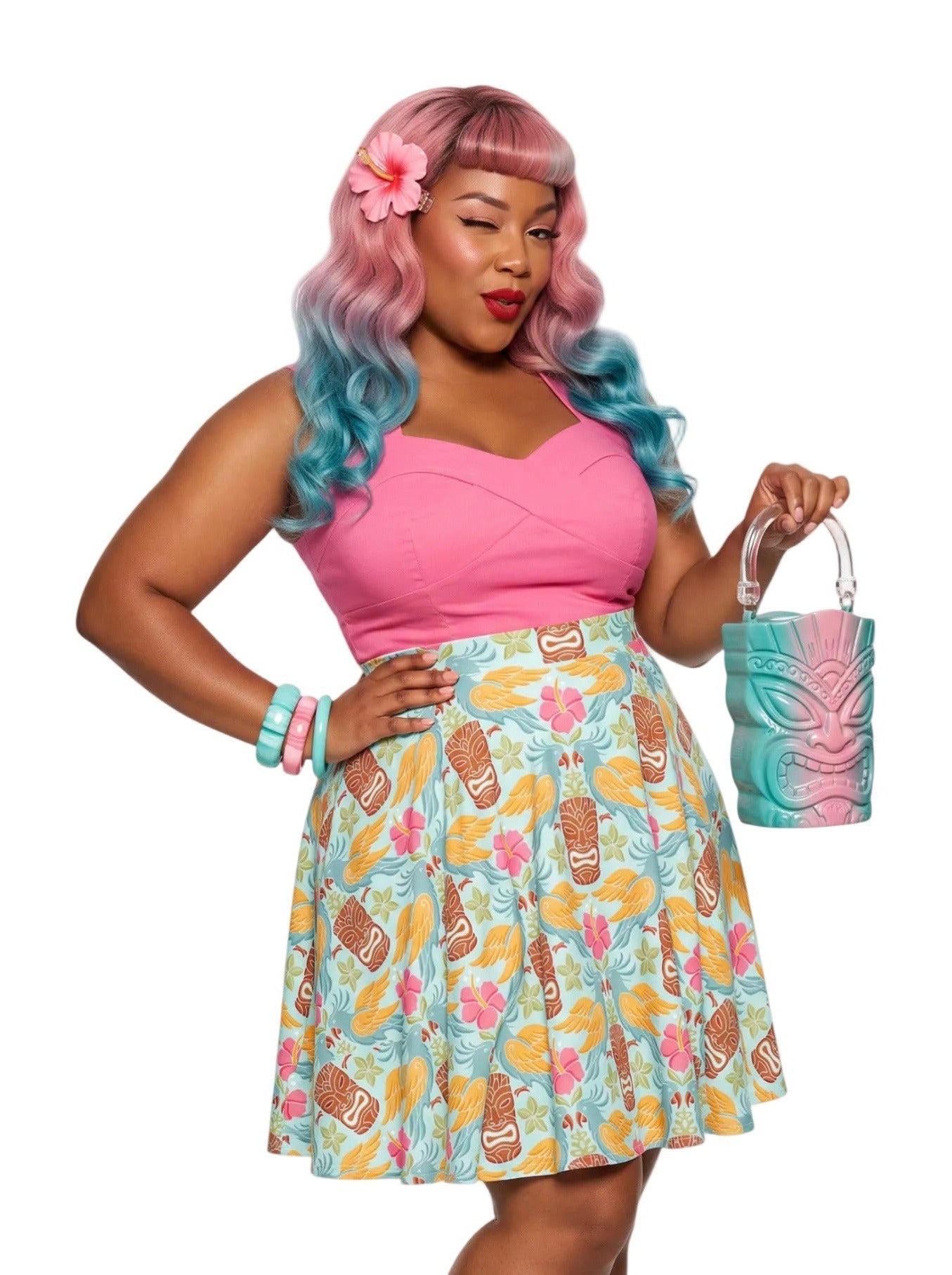 A plus-size woman wearing a Retro Tiki Cockatoo and Pink Hibiscus Flower printed high-waisted pinup A-line swing skirt.