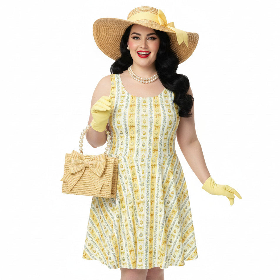 Plus size woman wearing a yellow 1950s vintage-inspired fit and flare dress with an Easter egg pattern, styled with a straw hat and pearls.