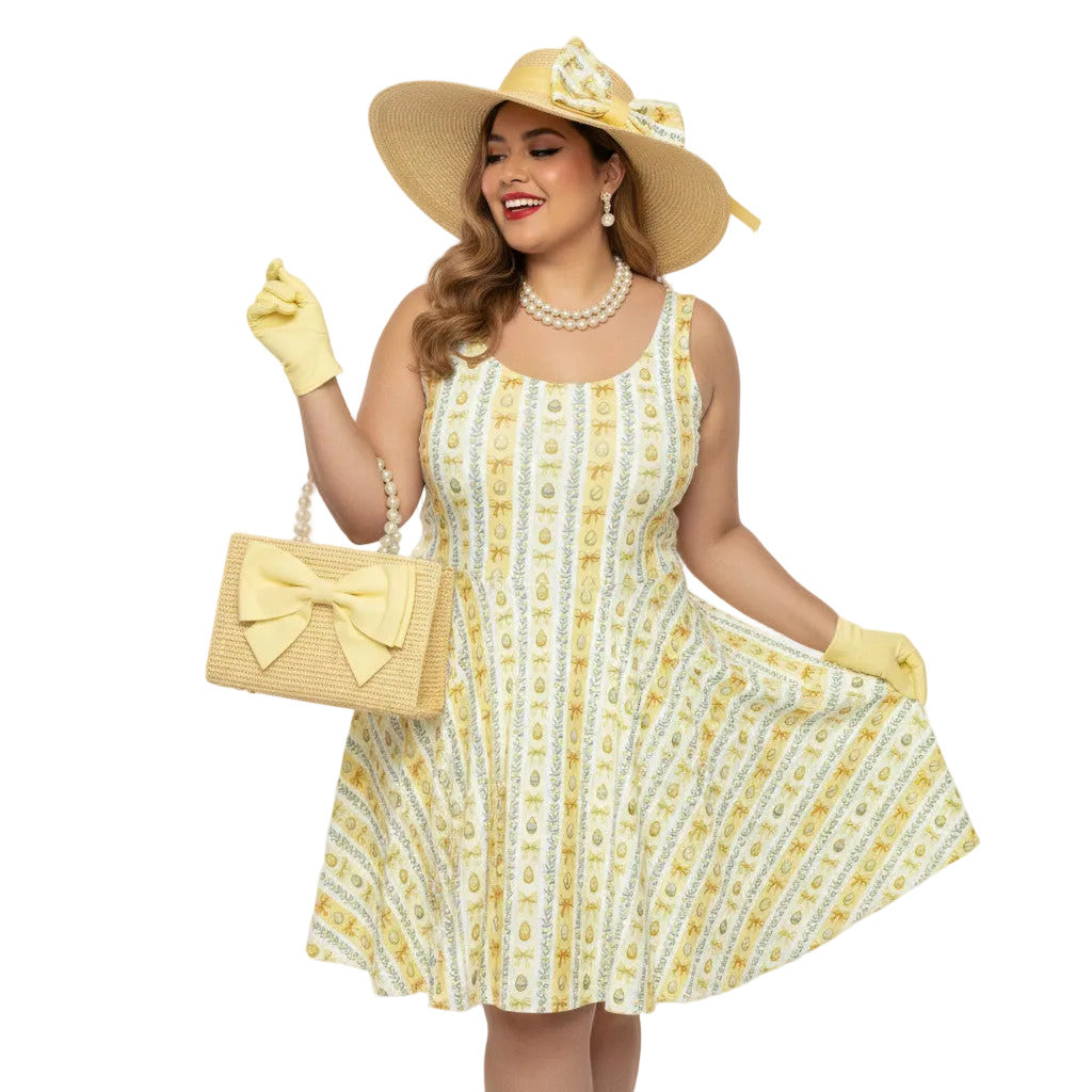 Plus size woman wearing a yellow 1950s vintage-inspired fit and flare dress with an Easter egg pattern, styled with a straw hat and pearls.