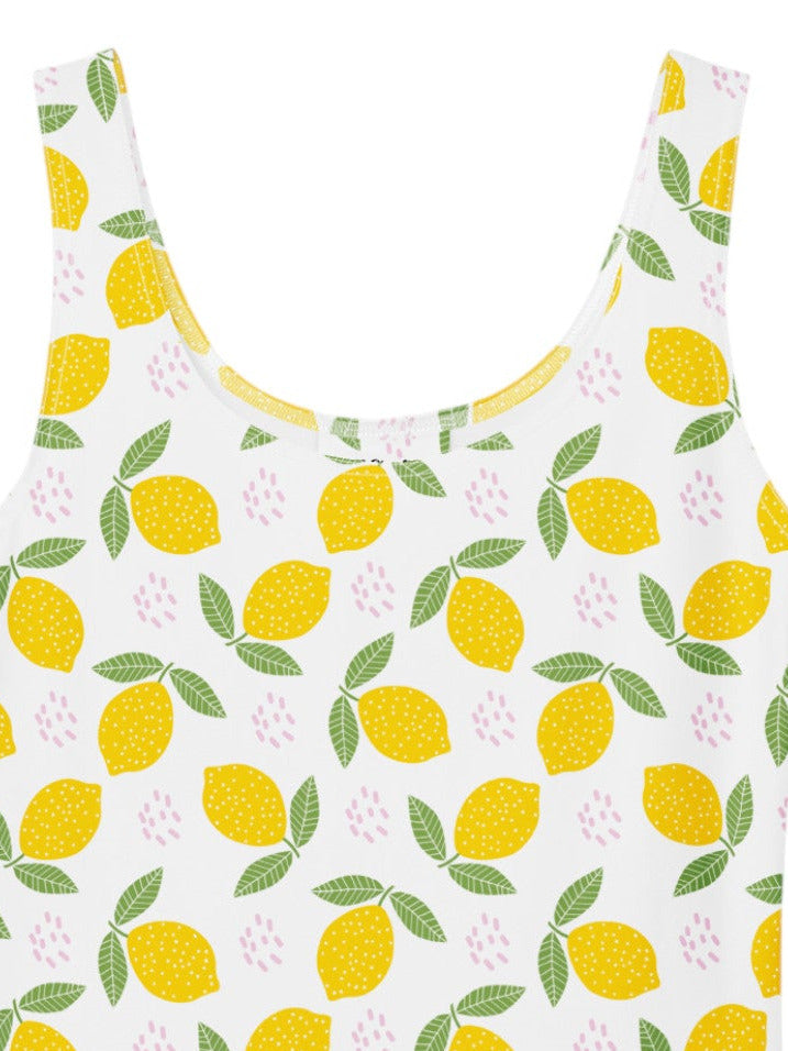 lemon print vintage swing dress with a fit and flare silhouette and yellow citrus pattern.