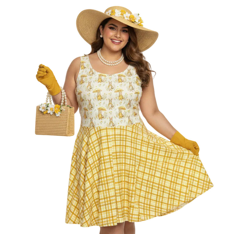 Plus size woman wearing a yellow gingham and Mr. Rabbit print 1950s vintage style fit and flare swing dress with straw hat.