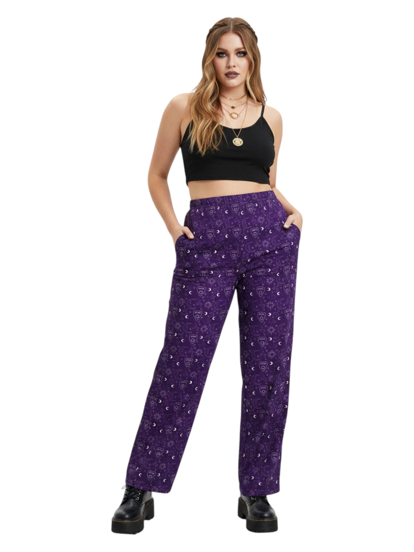 Woman wearing purple Whimsigoth wide leg lounge pants with celestial moon and sun print.