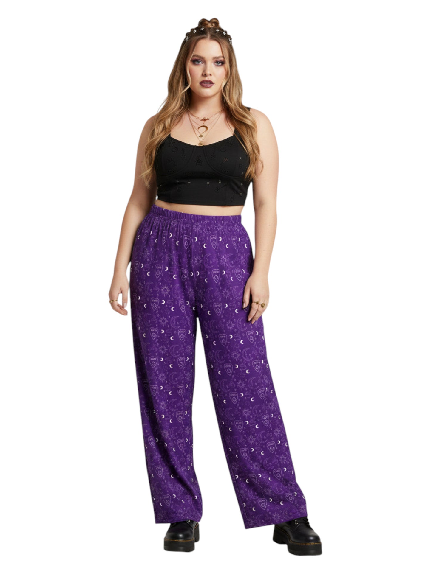 Woman wearing purple Whimsigoth wide leg lounge pants with celestial moon and sun print.
